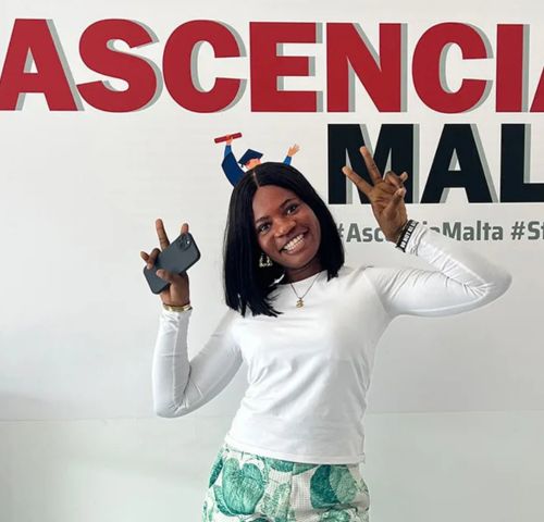 Ascencia Malta student Doris smiling with certificate, showcasing student success and international education journey in Malta
